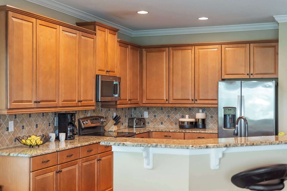 Modern kitchen with granite countertops and stainless steel appliances