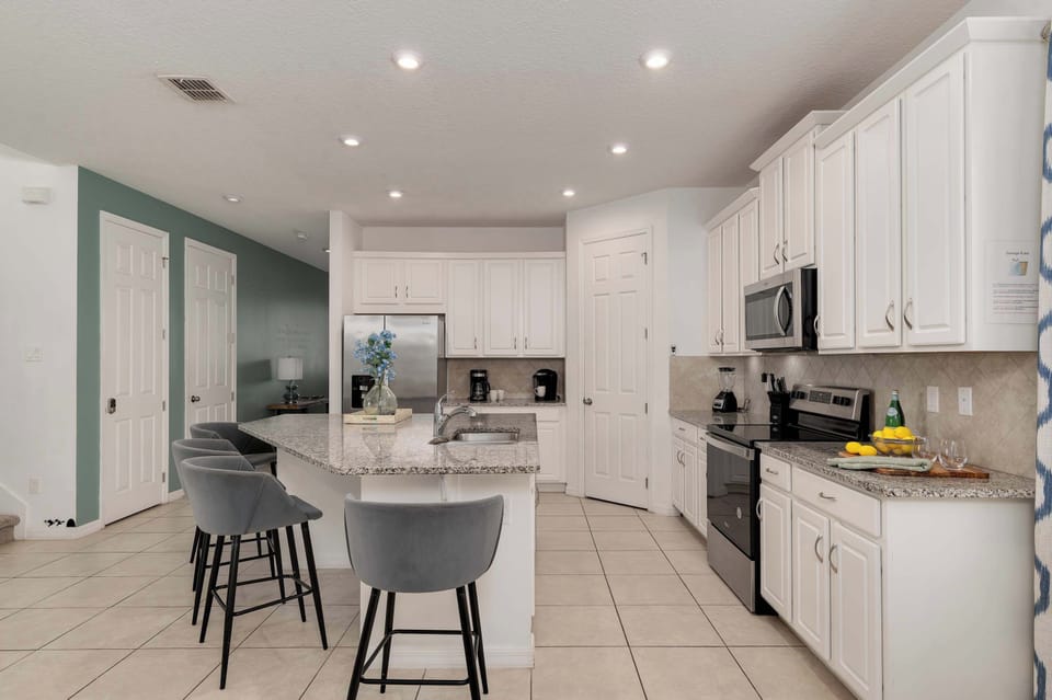 Modern kitchen with granite countertops and stainless steel appliances