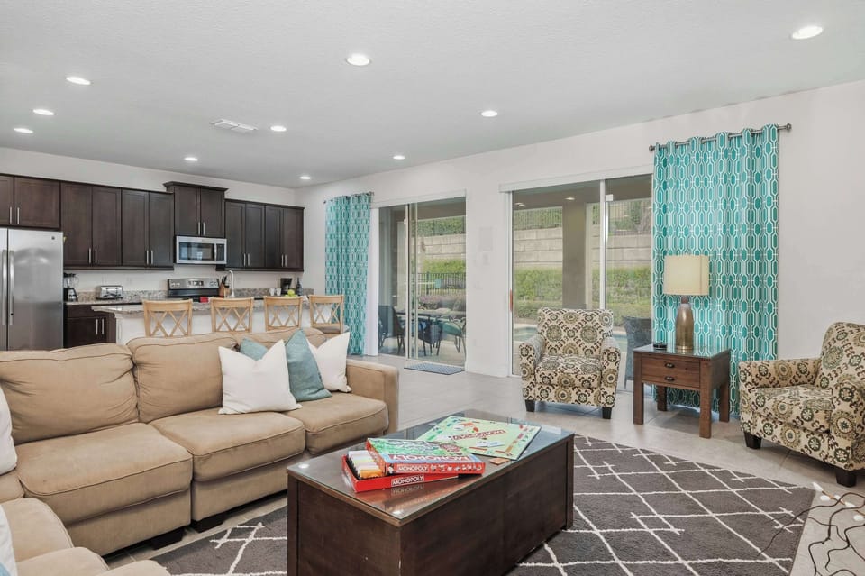 Open-concept living area with comfortable seating and a fully equipped kitchen.
