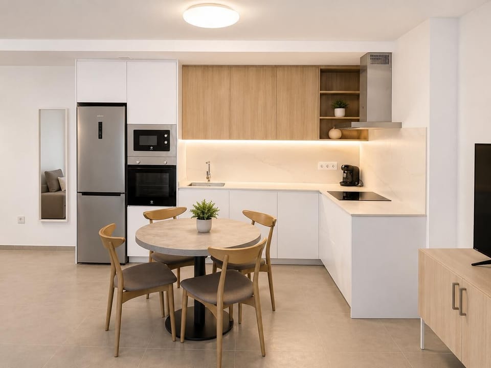 A modern open-plan living and dining area with elegant neutral decor.