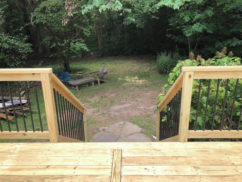Deck's steps down to fire pit area (forgive the construction mess in the photo!)