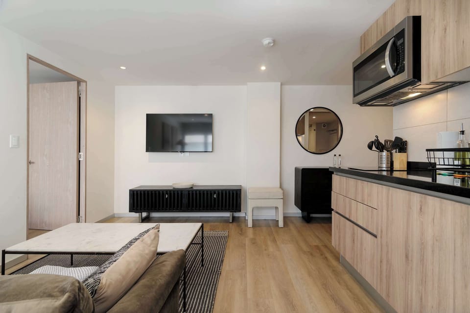 Fully equipped kitchen connected to the living area.