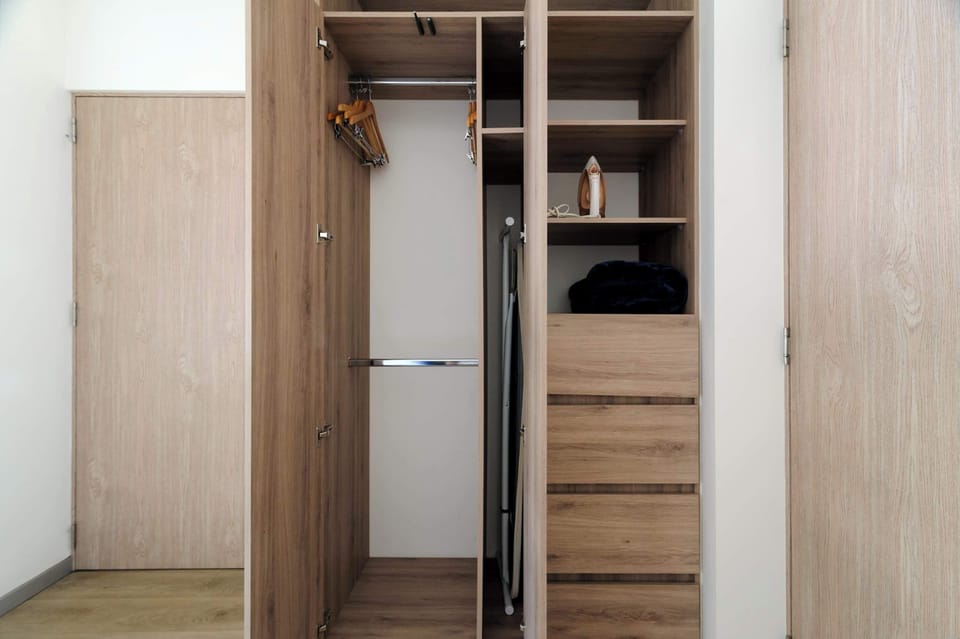 Open wardrobe with plenty of storage space.
