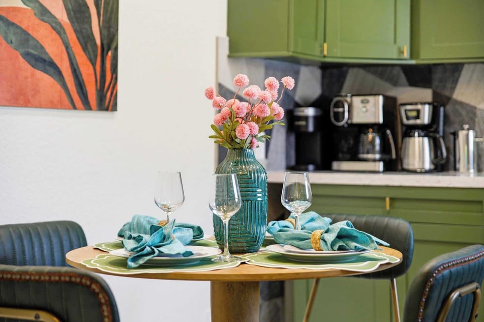Every detail is vacation-ready! A beautifully styled table, gold pendant lights & a fully equipped kitchen make cooking in feel just as good as going out.