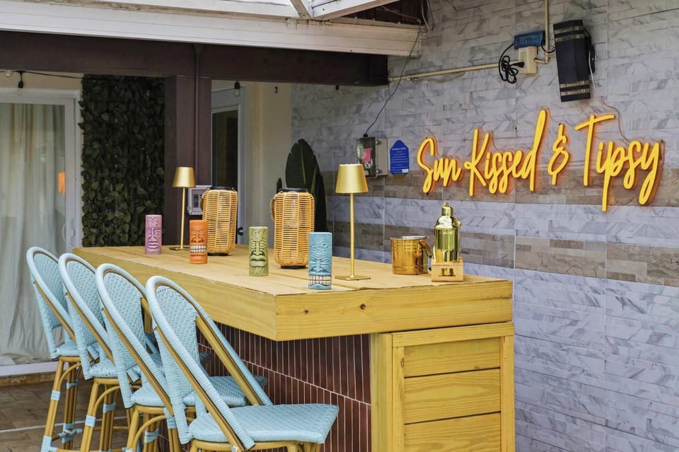 Discover your new favorite hangout spot! Featuring chic bar seating and an inviting atmosphere, our outdoor setup is the perfect place to kick back, relax, and soak up the vacation vibes.