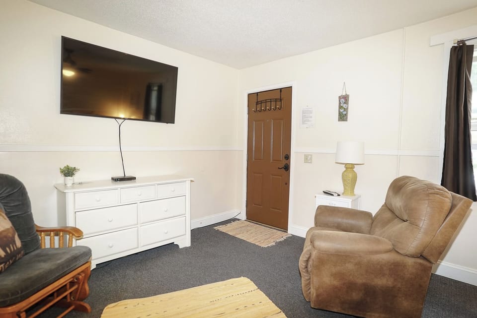 Superior Studio Suite | Living area | 50-inch Smart TV with cable channels
