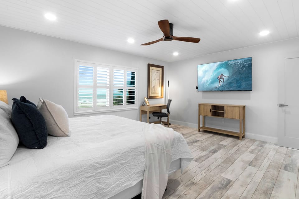 Master bedroom features a king bed and smart TV