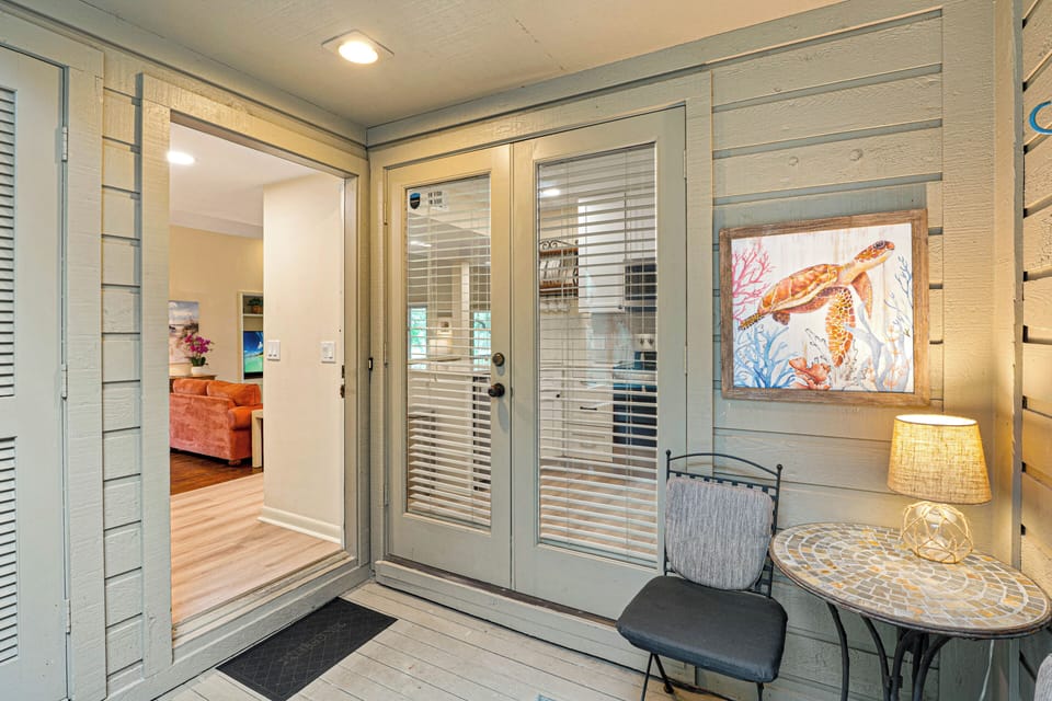 Step inside to a bright, inviting hallway that leads directly into the main living space, with natural light drawing you forward.