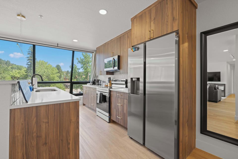 Modern kitchen with stainless steel appliances for cooking all your favorite foods.