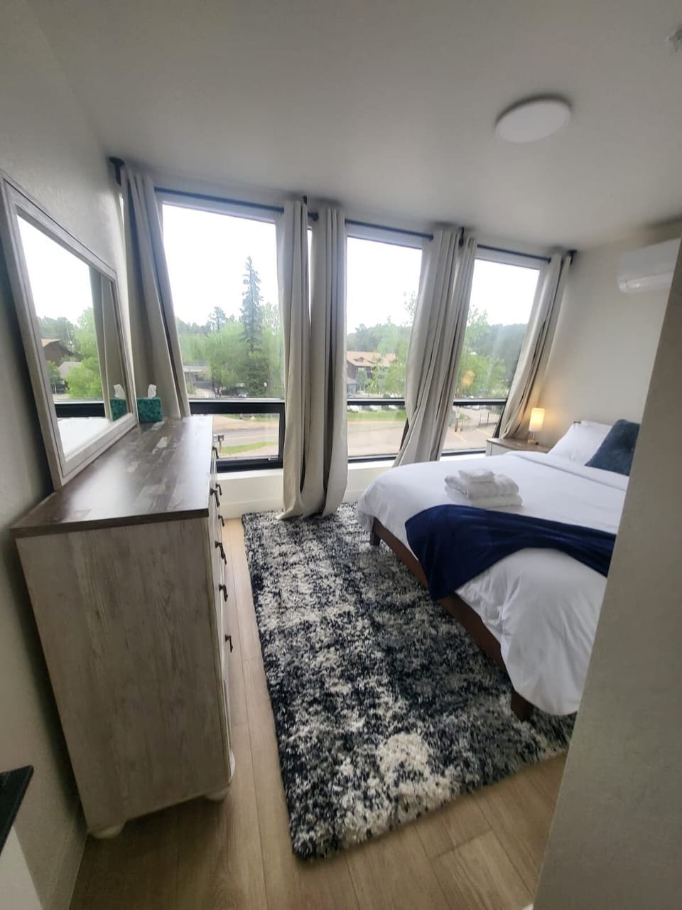 Guest room has a queen size bed with gorgeous views and blackout curtains.