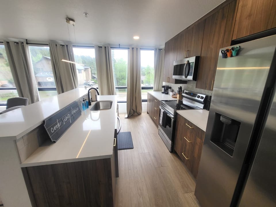 Modern kitchen with stainless steel appliances for cooking all your favorite foods.