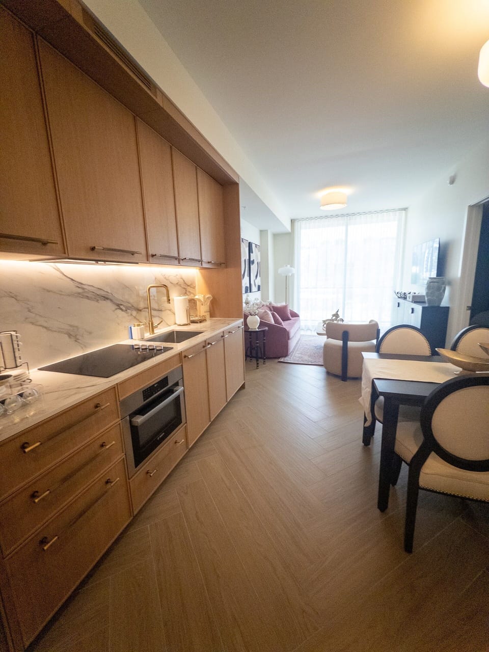 Bright open-concept layout where kitchen, dining and living blend into one airy, light-filled great room.