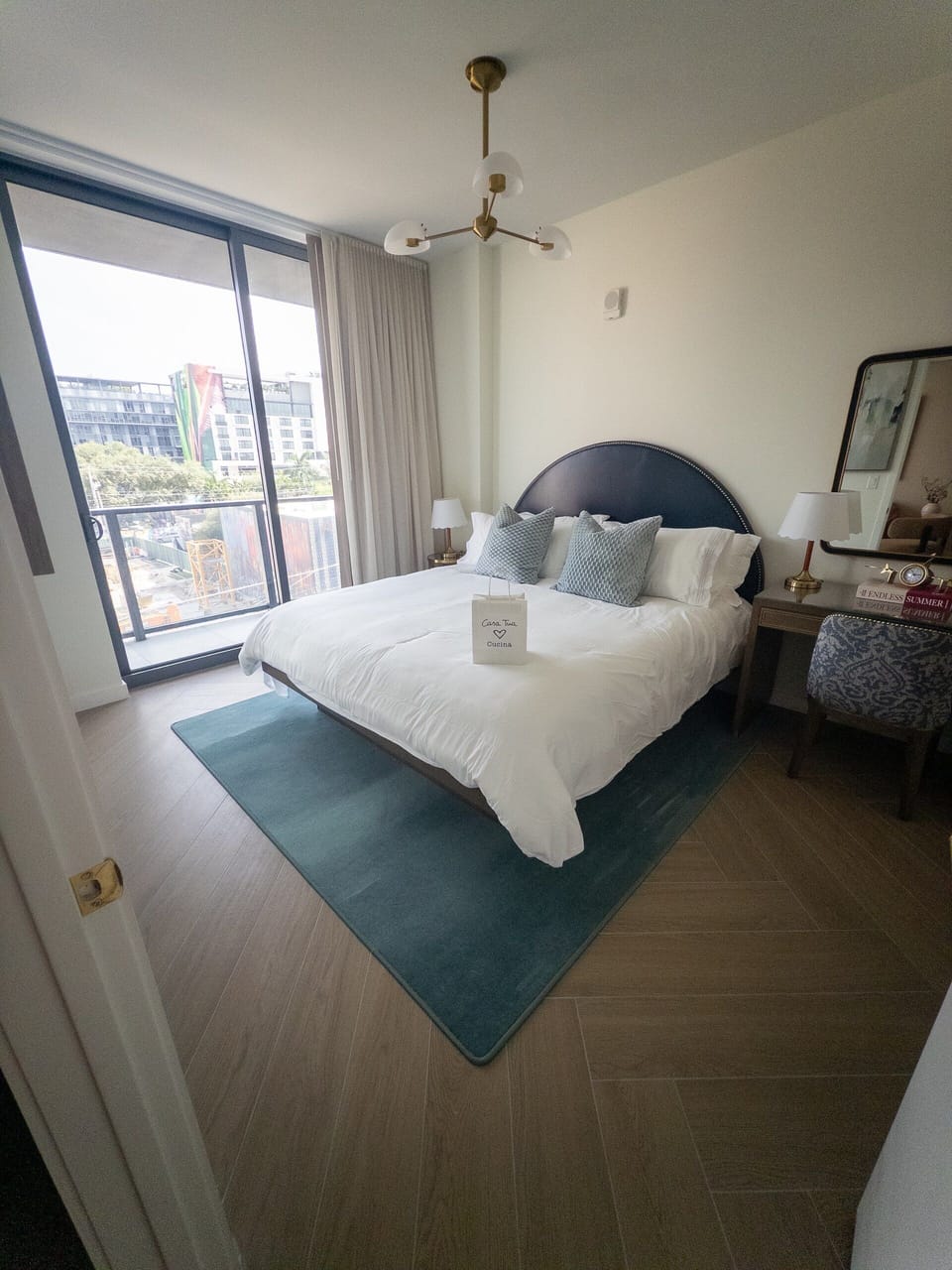 Wake up to city views pouring through floor-to-ceiling windows beside the king bed.