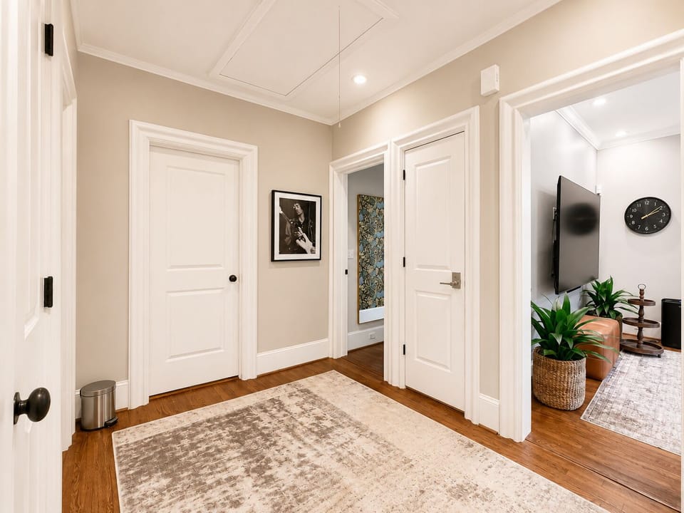 Large Central Hallway Connecting Guest Bedrooms, Bathrooms, Living Areas.