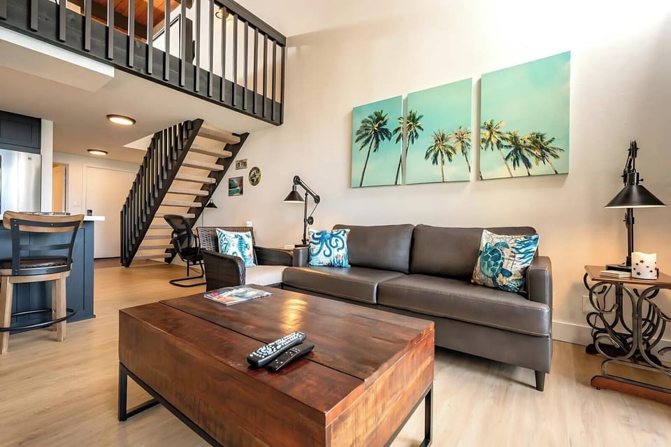Soak up the sea from plush leather seating as palm prints, woven accents, and warm wood elevate every detail   NAP-C43