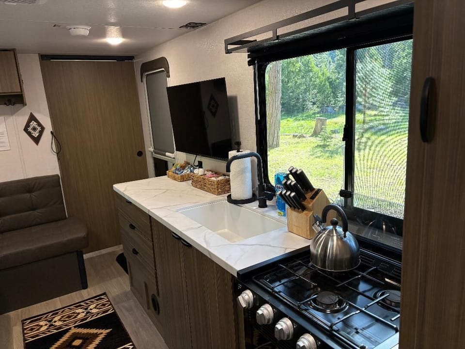 A peaceful meadow view that makes even doing dishes feel optional.