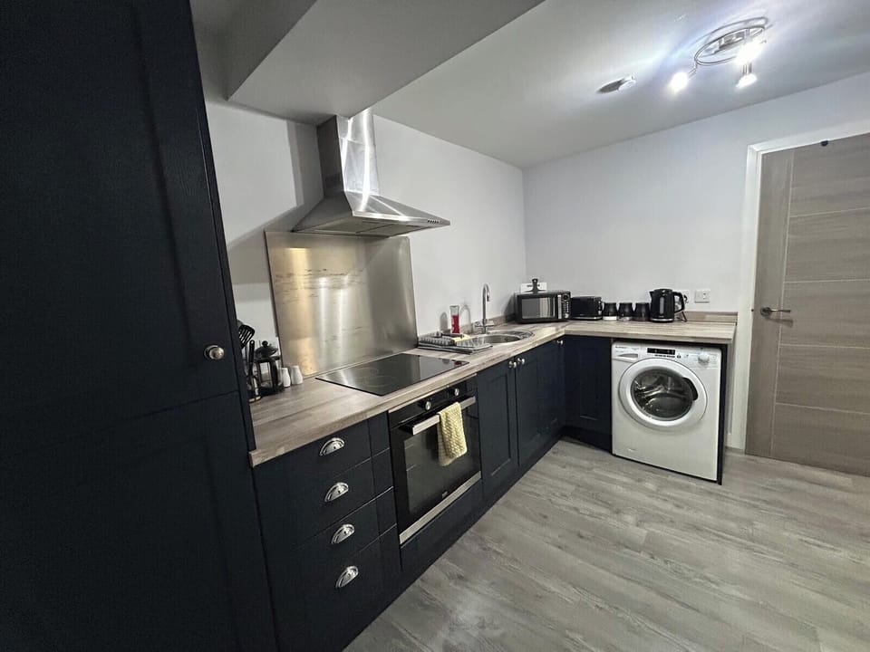 Kitchen — Fully equipped kitchen: oven, hob, microwave, washing machine