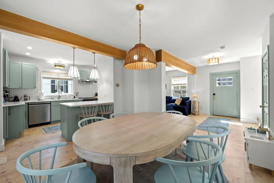 Gather around the dining table in this bright, open living space.