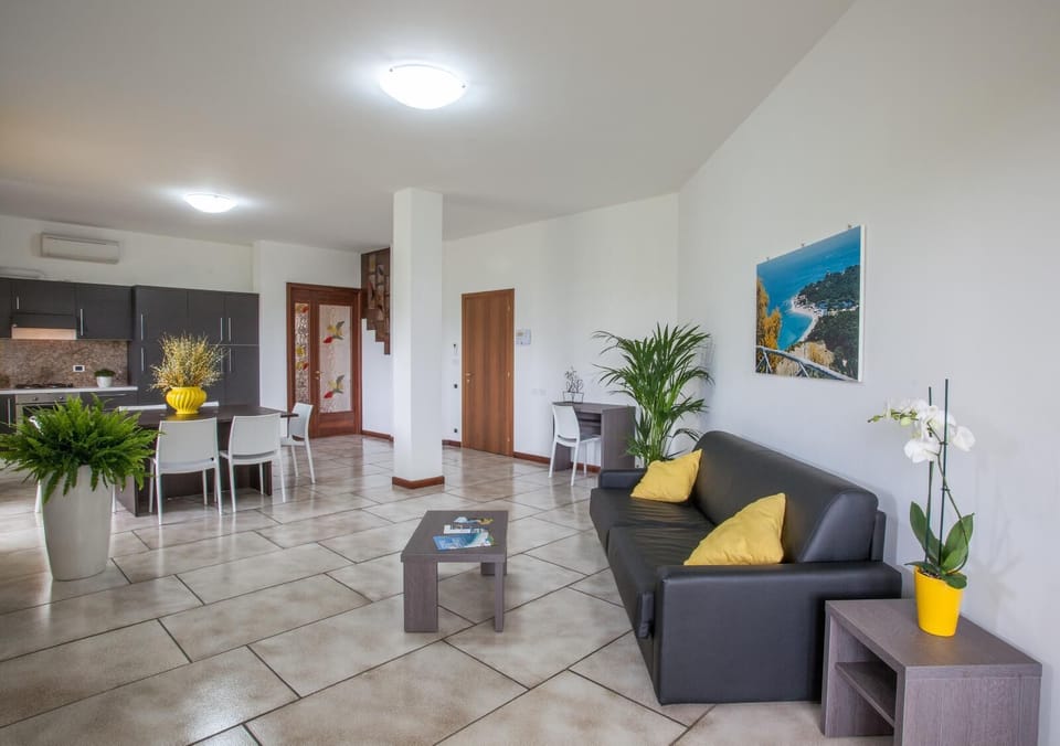 Family Apartment, Sea View | Living room | Flat-screen TV