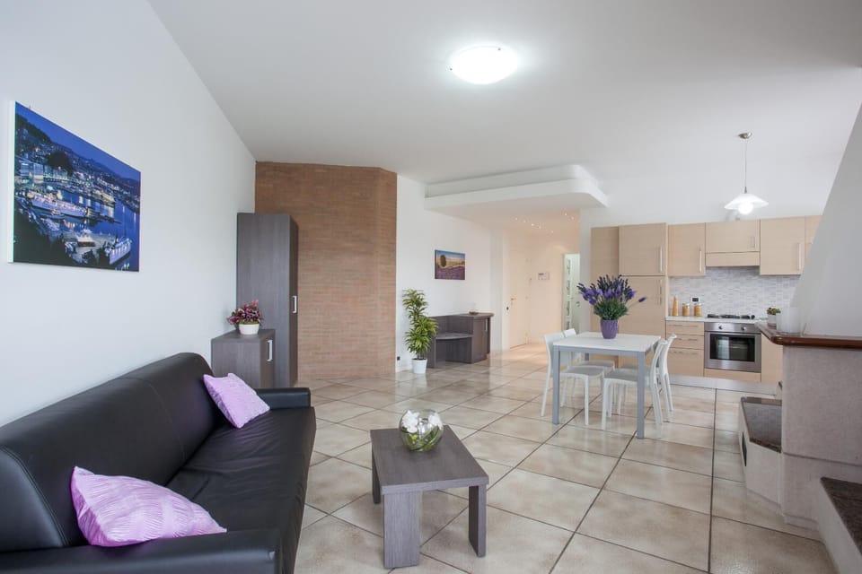 Executive Apartment, Sea View | Living room | Flat-screen TV