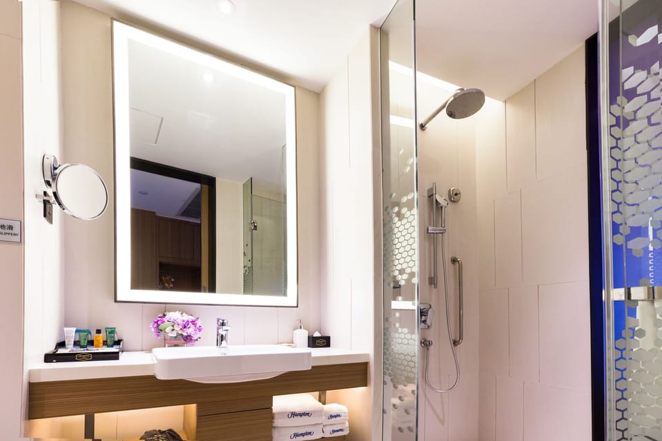 Shower, hair dryer, towels, shampoo