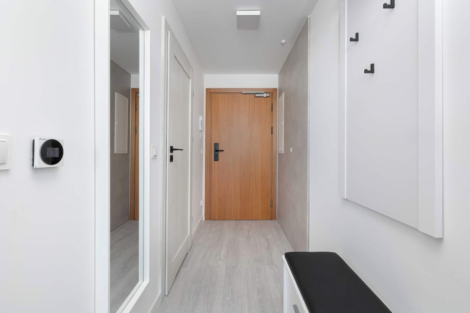 Bright entrance area with modern finishes and secure residential access.