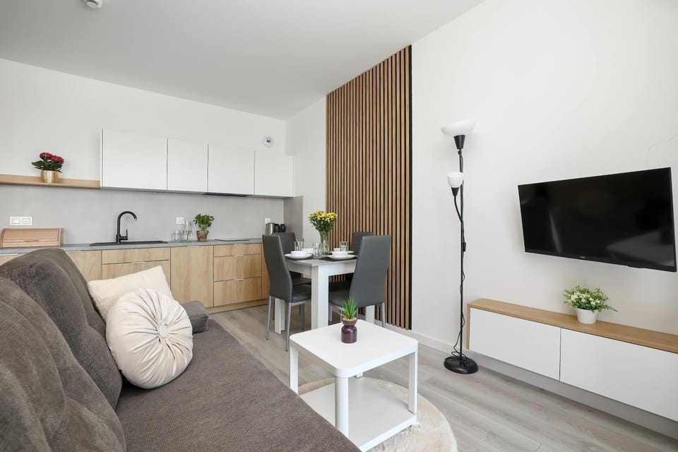 Spacious lounge area with Smart TV and comfortable seating for relaxing evenings.
