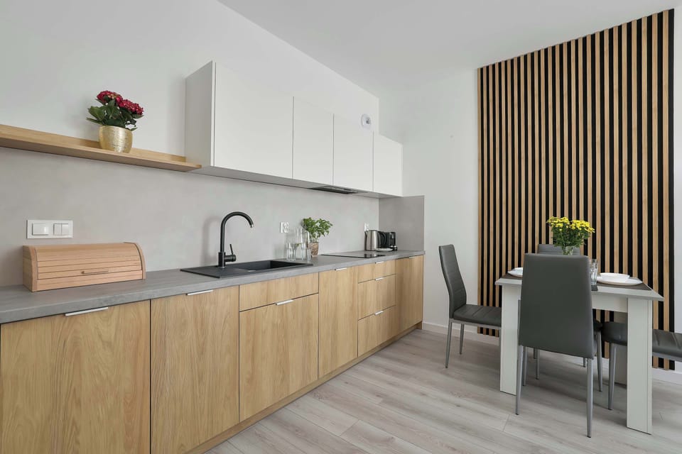 Fully equipped contemporary kitchen with modern appliances, ample storage, and stylish finishes.