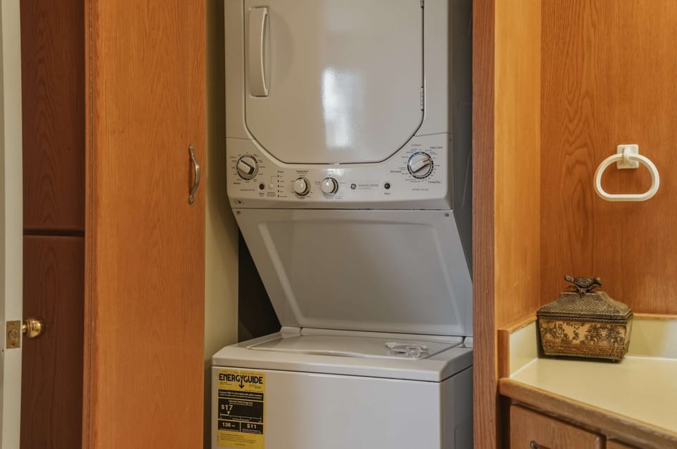 Shared ensuite with shower/tub combo, and laundry area, accessible from the living area 
