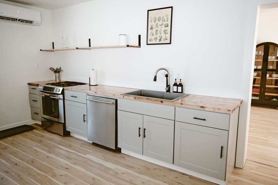 Modern Kitchen: Whip up culinary delights in this stylish, well-equipped kitchen with ample space!