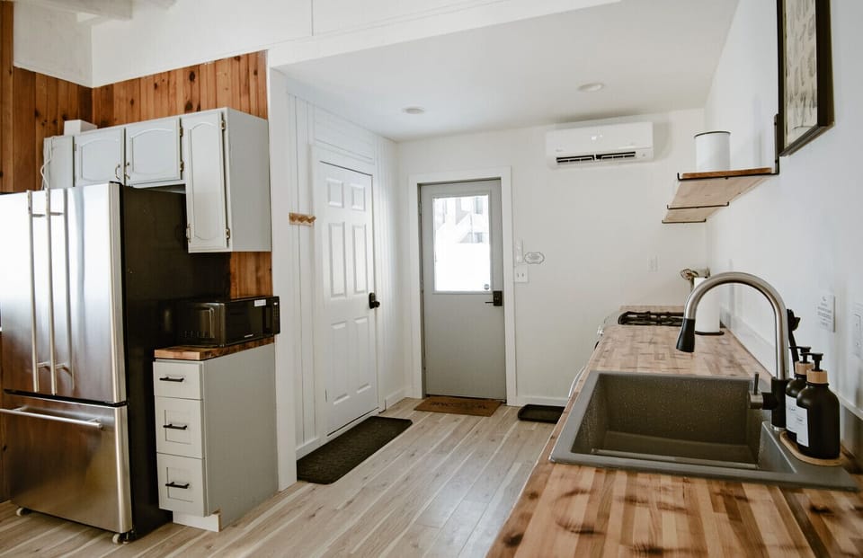 Kitchen: Whip up delightful meals in this stylish, modern kitchen designed for culinary adventures!