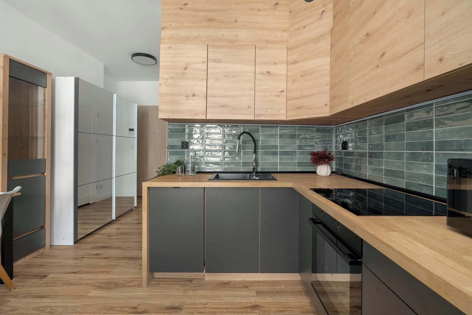 Fully equipped kitchenette with modern appliances and ample cabinet space.