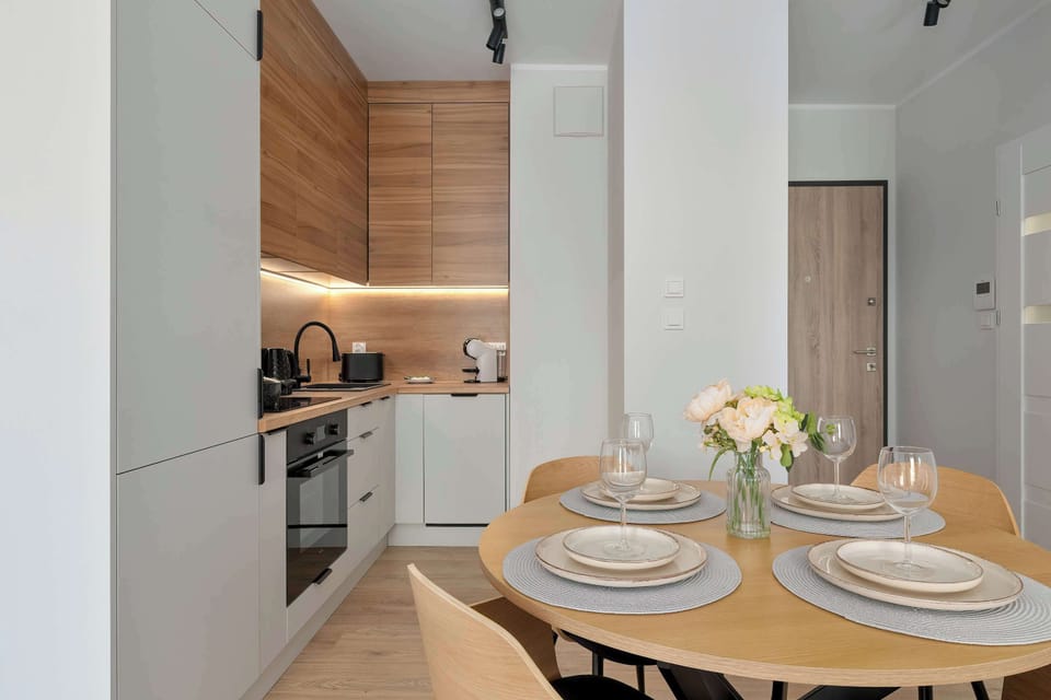 Dining area conveniently connected to the modern kitchenette.