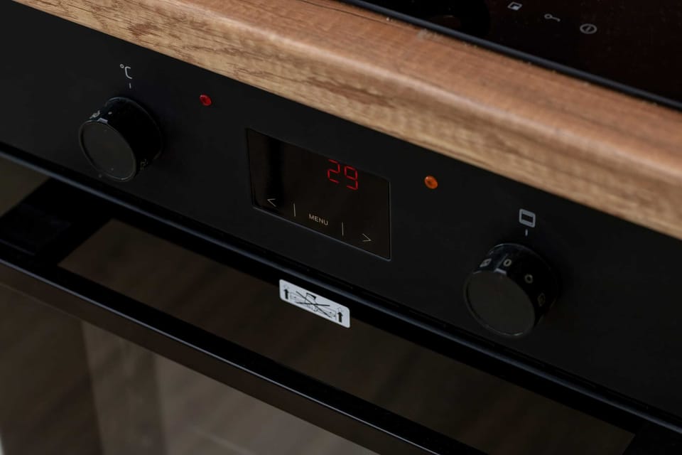 Modern built-in oven and kitchen appliances for convenient cooking.