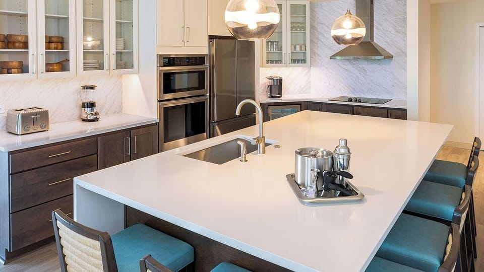 Fully equipped kitchen and upgraded appliances with under counter wine cooler.