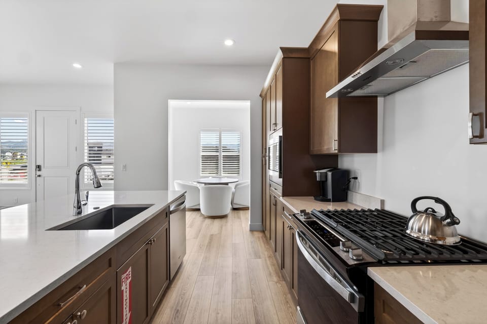 Fully equipped kitchen with a large island that keeps cooking, dining, and lounging connected.