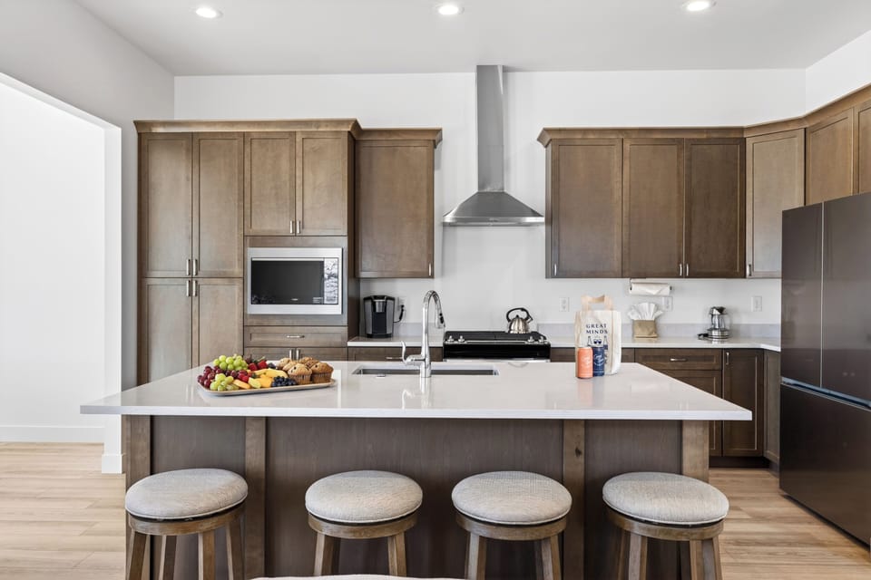 Chef’s kitchen with a spacious island, bar seating, and plenty of room for gathering over meals.