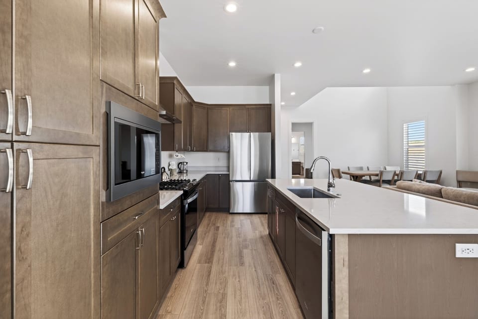 Fully equipped kitchen with a large island that keeps cooking, dining, and lounging connected.