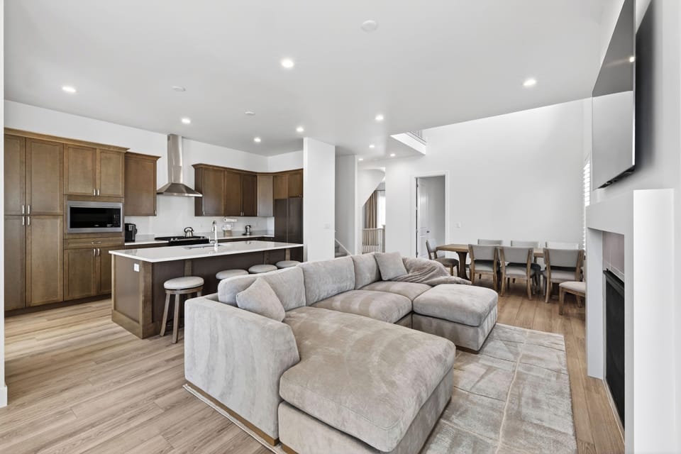 Open-concept living, dining, and kitchen area designed for easy group gathering.