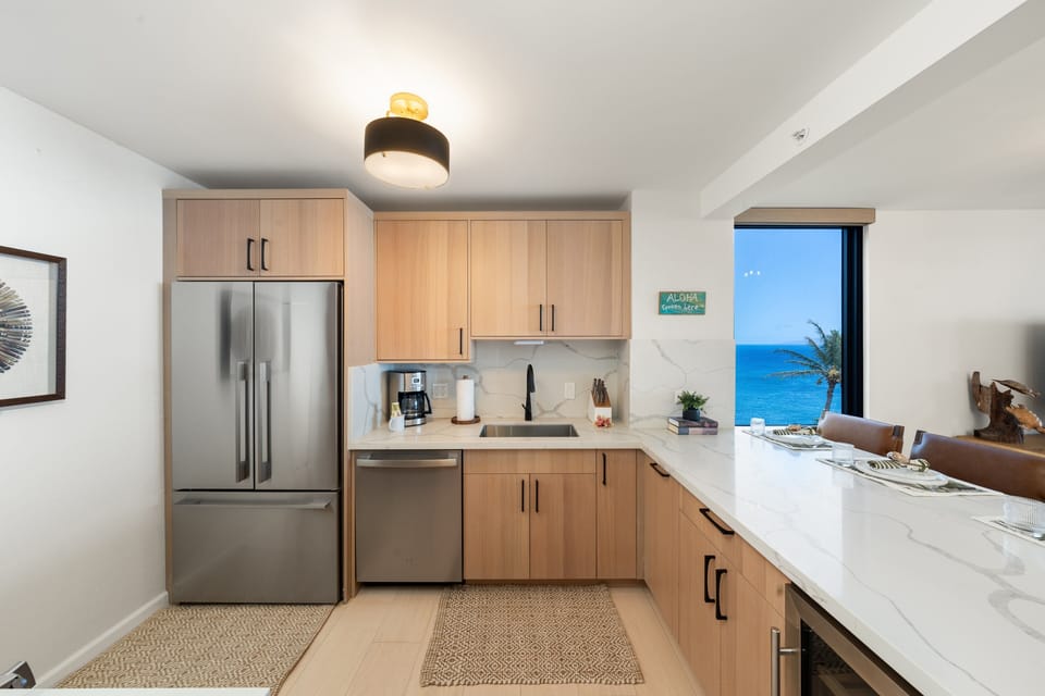 Enjoy ocean views while preparing meals in this beautifully updated kitchen designed for both style and functionality.