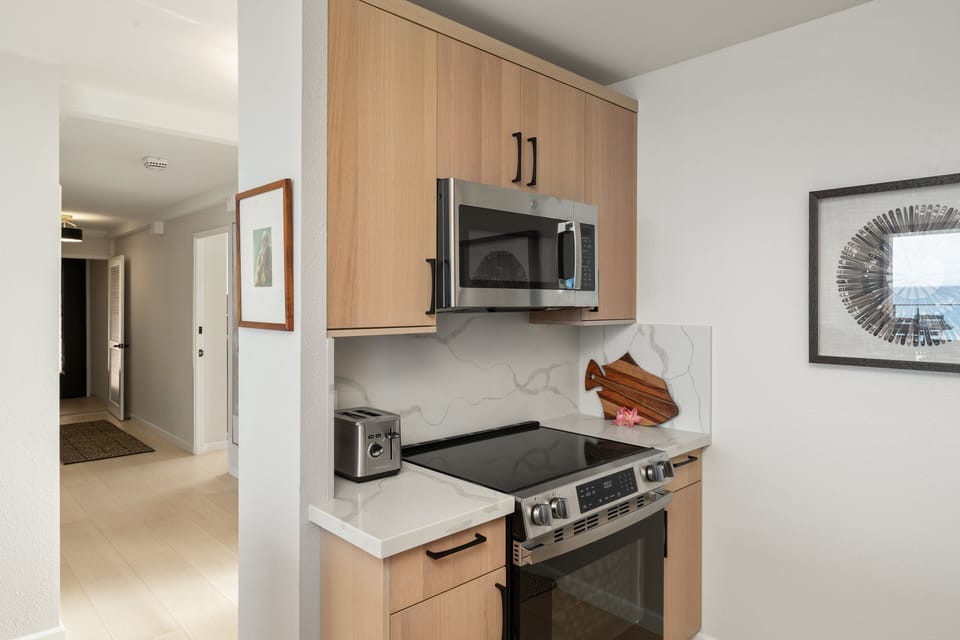 This fully equipped kitchen combines modern convenience with coastal style, providing everything needed for meals at home.