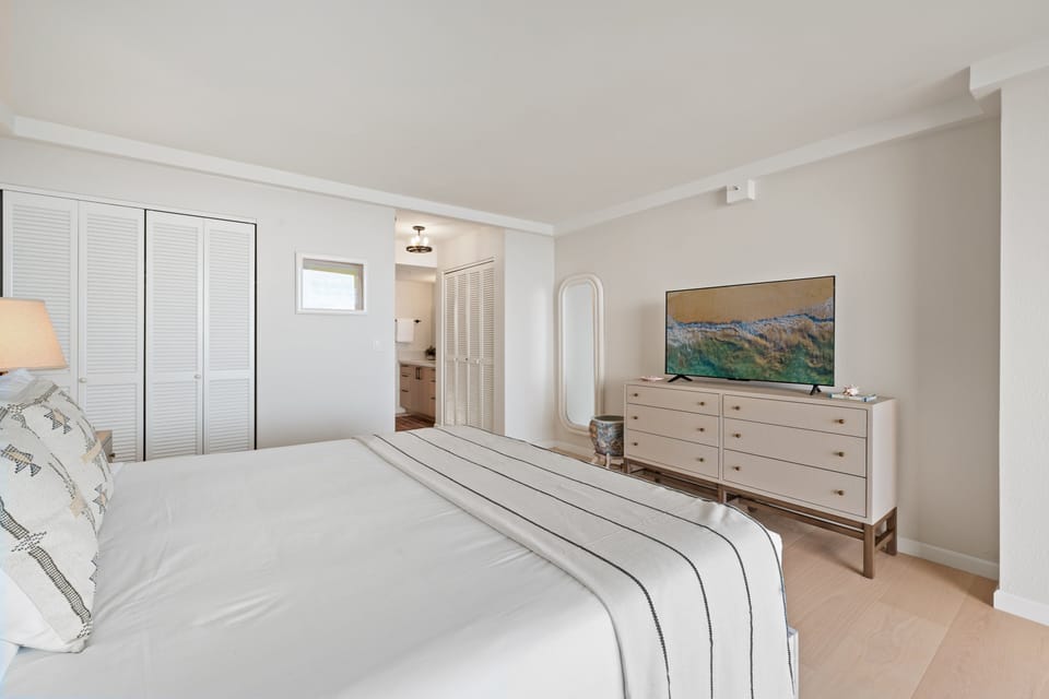 Enjoy restful nights in a beautifully updated bedroom just steps from the oceanfront lanai.