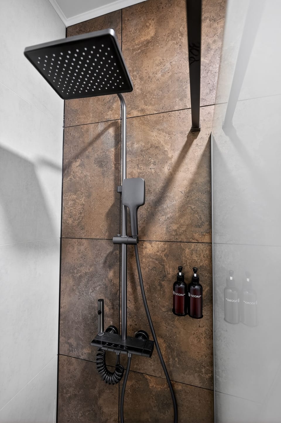 Shower, hair dryer, slippers, towels