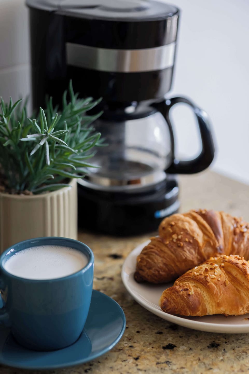 Freshly brewed coffee and breakfast pastries creating a warm and welcoming atmosphere.
