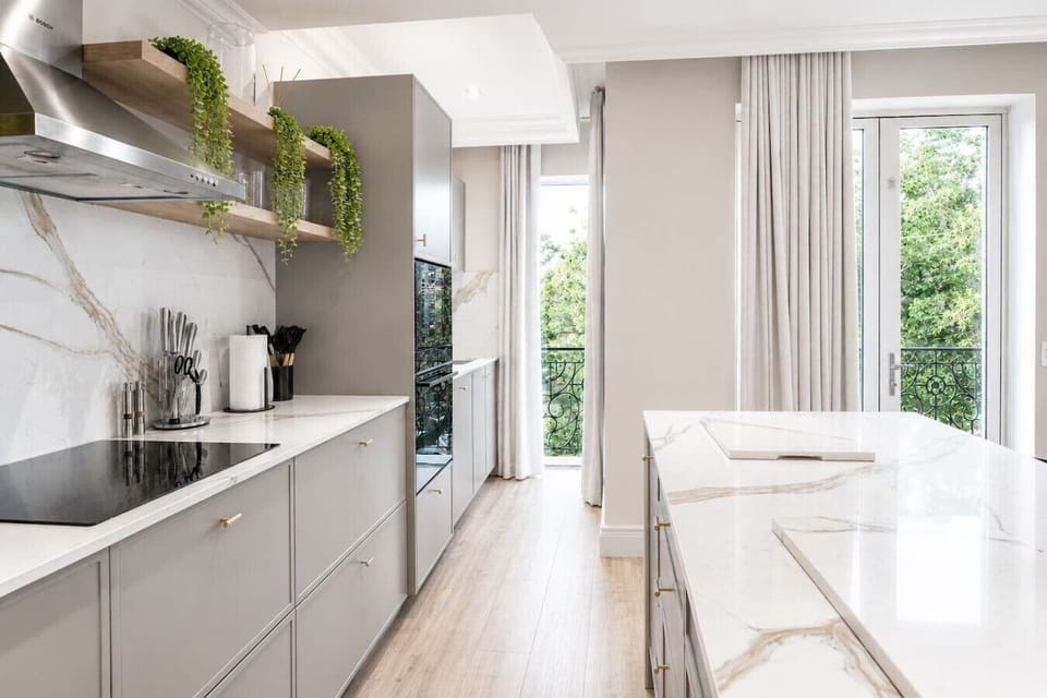 Bright, contemporary kitchen with premium finishes, abundant natural light, and a spacious island, perfect for cooking, dining, and entertaining.