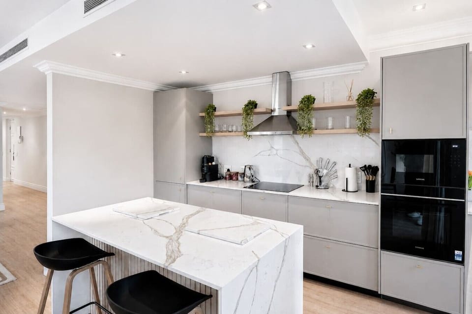 Contemporary chef’s kitchen with premium appliances, sleek finishes, and a spacious island, ideal for preparing meals and entertaining.