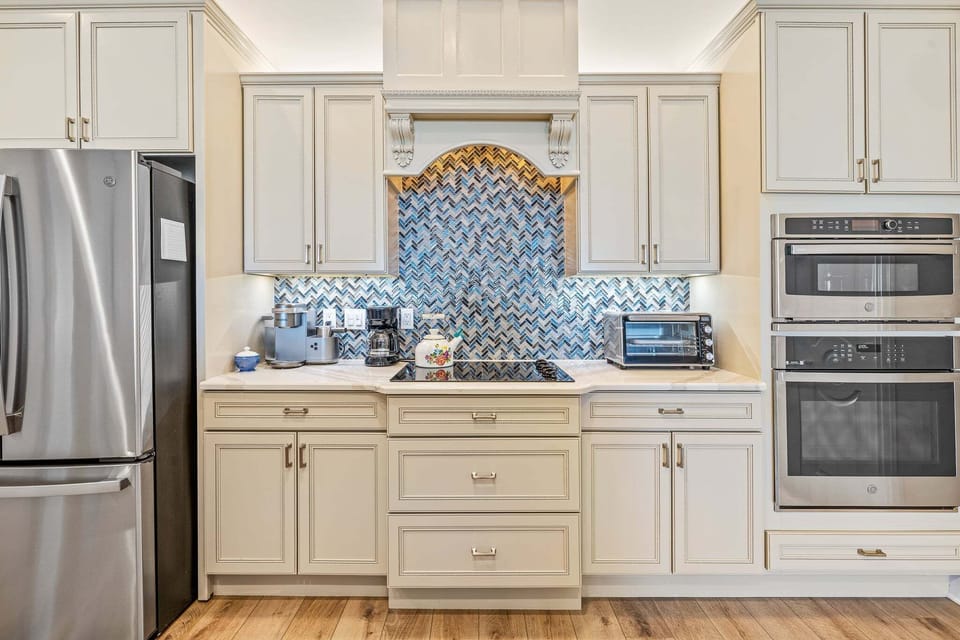 Custom cabinetry, premium appliances, and designer finishes create a stunning culinary space.