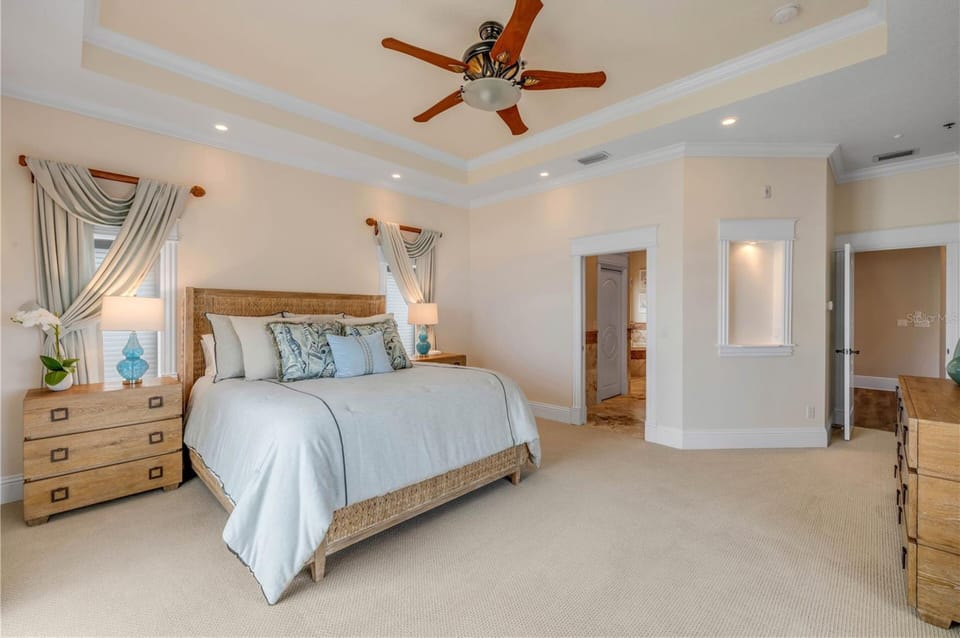 Stretch out and relax in this oversized primary suite featuring elegant furnishings, a king bed, and direct access to the luxurious en-suite bathroom