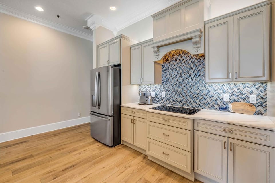 A beautifully designed kitchen featuring ample counter space, custom cabinetry, and everything needed to prepare meals for your group.