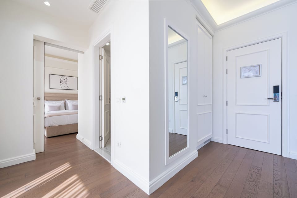 Deluxe Apartment | Living area | 50-inch Smart TV with satellite channels